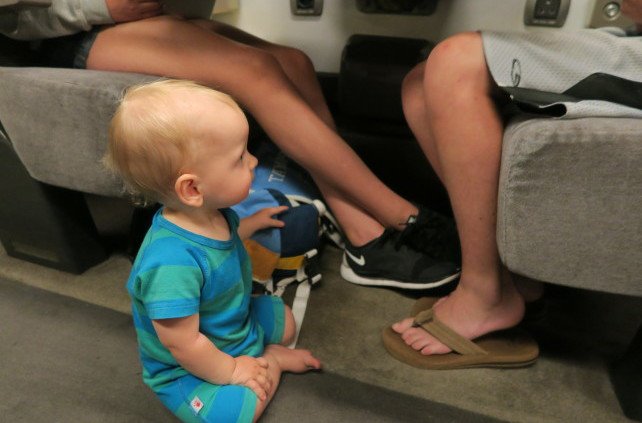 Baby befriending strangers on train