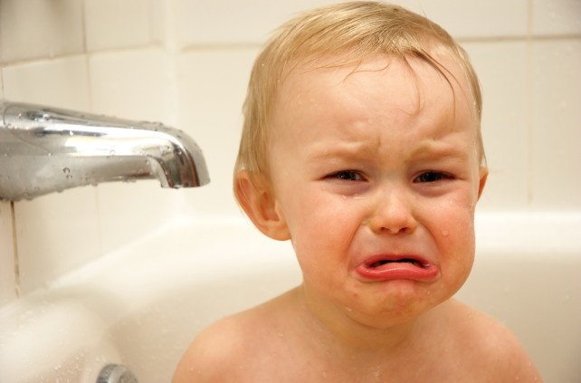 Baby crying in bathtub