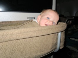 Flying with an infant: long haul, baby in bassinet on plane